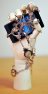 a smartphone, chained with handcuffs